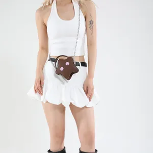 Brown star-shaped mini crossbody bag for girls with cute cartoon smile and silver chain strap