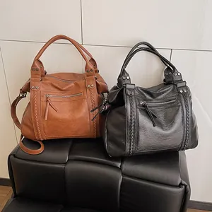 French vintage biker tote bags in brown and black leather with rivet details