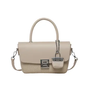 Retro shoulder bag with beige leather trim and woven texture featuring a silver square lock