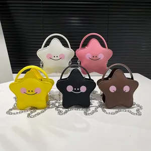 Star-shaped girls' mini crossbody bag with cute smiley face and metallic chain strap