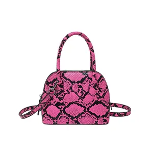Schicke Handtasche mit pink-schwarzem Schlangenmuster und verstellbarem Schultergurt