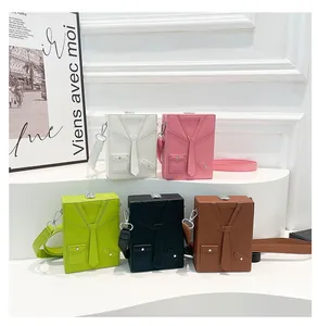 Detailed view of colorful suit-style box bags with lychee grain texture and tie decor