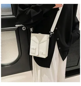 Close-up of white crossbody box bag with creative suit tie design and pebbled PU leather