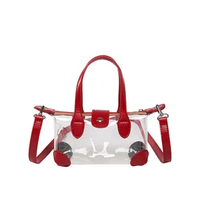 Transparente PVC-Tragetasche mit rotem Lederbesatz und Crossbody-Schultergurt