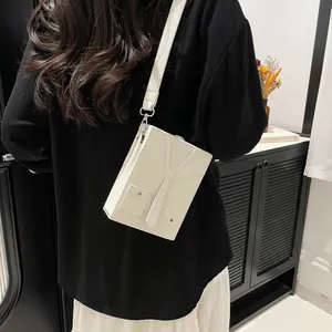 Creative white crossbody box bag with shirt and tie design and wide leather strap