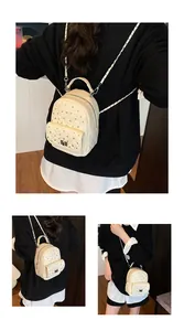 Tre viste del mini zaino crema trapuntato con strass e tracolla a catena