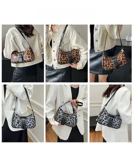 Detail showing vintage leopard print patterns and metal rivet studs on the shoulder bag