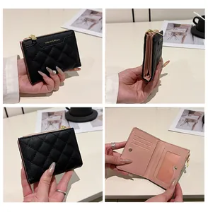 Detail view of black quilted women's wallet with multiple card slots and gold hardware