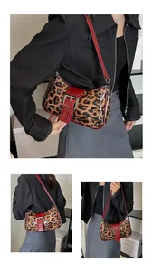 Close-up of leopard print bag with silver rivets and glossy red faux leather trim