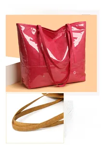 Macro detail of glossy crinkled pink tote bag texture and reinforced strap stitching