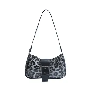 Retro Y2K leopard print underarm bag with silver rivets and buckle detail