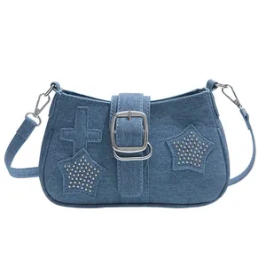 Y2K style denim shoulder bag with cross patches and silver metallic star rivets