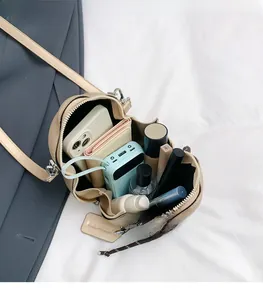 Interior view showing the large storage capacity for phone, wallet, and cosmetics