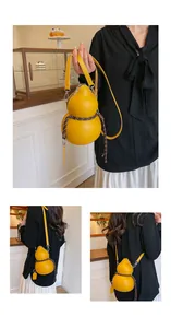 Detail of creative yellow gourd-shaped PU leather crossbody bag with woven decorative cord