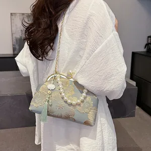 Ethnic style floral embroidery handbag with pearl handle and gold chain strap for women