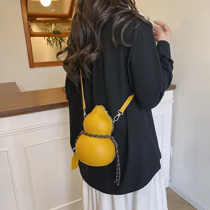 Unique yellow gourd shaped crossbody bag made of smooth leather for stylish men and women