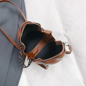 Brown gourd-shaped PU leather crossbody bag with silver zipper and black lining