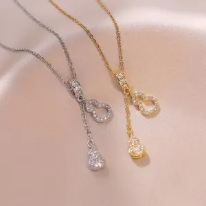 Eleganter Gold- und Silber-Kürbis-Anhänger mit Zirkon-Inlay und feiner Quaste