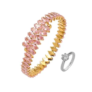 Golden bangle with pink marquise stones and silver cubic zirconia solitaire ring