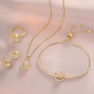 Golden star and moon jewelry set with sparkling zircons on elegant satin fabric