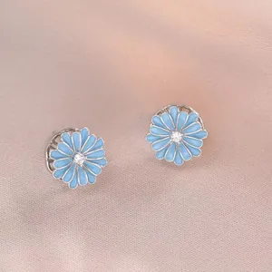 Daisy flower stud earrings in light blue enamel with a sparkling center zircon
