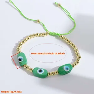 Handmade adjustable 18K gold plated bead bracelet with green evil eye charms for women