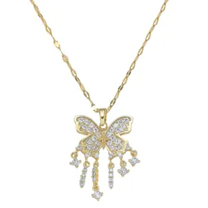 Golden butterfly tassel necklace with pavé zirconia stones on a minimalist gold chain
