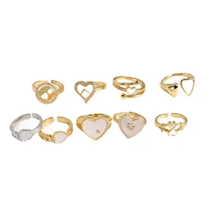 9pcs set of gold and silver shell heart rings with zircon stones for women