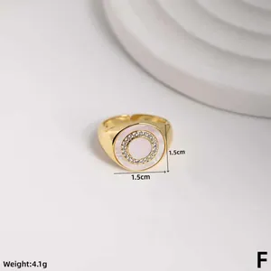 Detailed view of adjustable gold shell ring with cubic zirconia, size 1.5cm, weight 4.1g