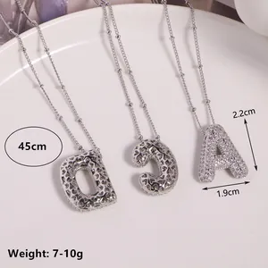 Silver 26 letter pendant necklace with cubic zirconia and heart hollow detail 45cm chain