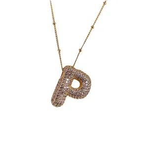 P-letter necklace in 18K gold plated copper with micro-paved zircons and beaded chain