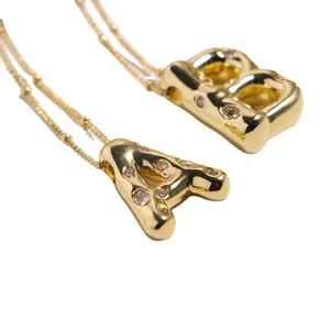 3D gold plated alphabet pendants A and B with pink zircons on round bead chains