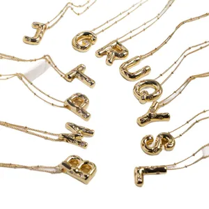 Gold plated initial bubble letter pendant necklace set with zircon stones on bead chains