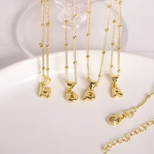 Detail of 3D balloon letter pendants with beaded gold-plated chains and lobster clasp