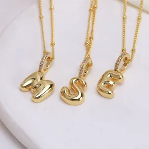 18K gold plated bubble initial necklace featuring letters M, S, E with zircon details