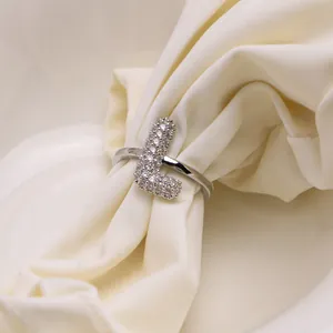 Close-up of silver chunky bubble ring with sparkling pavé zircon letter L detail