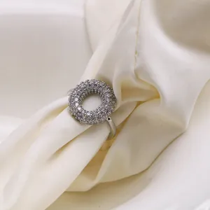 Elegant silver ring with a sparkling pavé-set round circle top on soft satin background