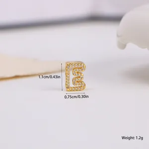 Macro shot of letter E gold charm with cubic zirconia pavé and size dimensions