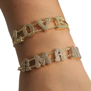 Goldene LOVE und MAMA Halsketten mit funkelnden Zirkonia Steinen für Damen