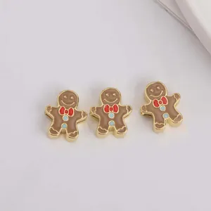 Drei Emaille-Lebkuchenmann-Anhänger mit roten Schleifen für Weihnachts-DIY-Schmuck
