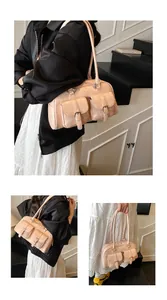 Detailed views of the light pink faux leather shoulder bag with buckle pockets