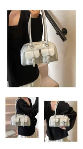 Y2K style light gray PU leather bowling bag with multiple front flap pockets and slim handles