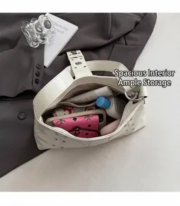 Detail view showing large interior capacity of the white tote bag with multiple compartments