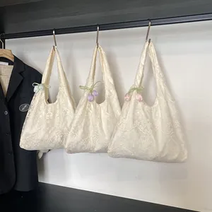 Set of three white floral lace tote bags with colorful tulip pendants for daily commute