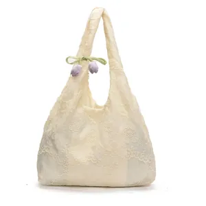 Chic beige lace tote bag with crochet floral patterns and purple tulip charm decoration