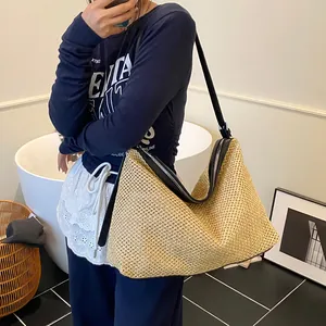 Retro woven straw hobo bag with black leather straps and large capacity for summer beach use