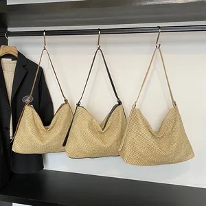 Retro woven straw tote bag in three colors hanging on a rack for summer beach fashion