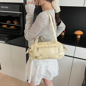 Fashionable cream PU leather shoulder bag with silver zipper and adjustable strap detail