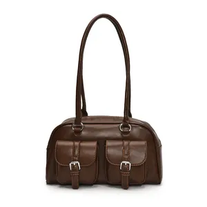 Vintage brown leather bowling bag with front pockets and long shoulder straps
