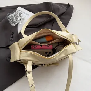 Modern cream PU leather large shoulder bag showing spacious interior with zipper closure